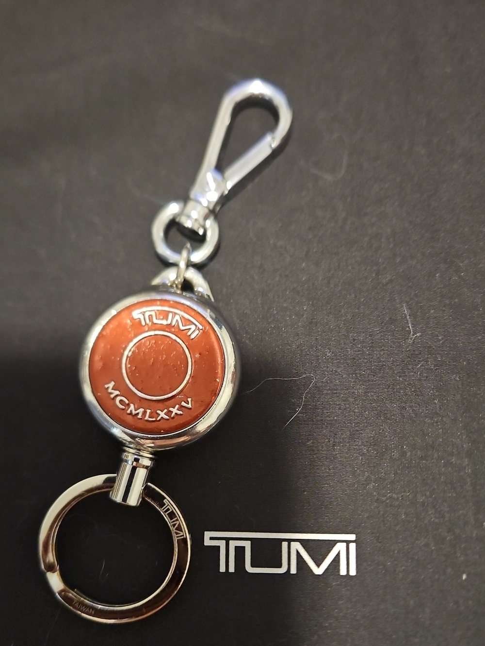 Tumi Orange Leather Round Key Fob with Silver Hardware